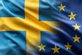 Flags of Sweden and EU blowing in the wind