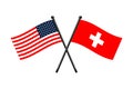 Flags of Switzerland and Usa crossed on the sticks Royalty Free Stock Photo