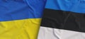 Flags of Ukraine and Estonia. Linen flags close up. Flag made of canvas. Ukrainian. Estonian, Tallinn. National symbols. 3d Royalty Free Stock Photo