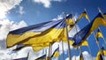 Flags of Ukraine in EU, sign of solidarity in the fight for freedom against the Russian occupiers. Against the blue sky. Slava