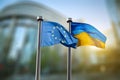 Flags of Ukraine and European Union against EU parliament Royalty Free Stock Photo