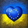 Flags of Ukraine and European Union.Flag heart on the background of the Ukrainian flag painted on a stone. The concept of