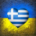 Flags of Ukraine and Greece. Flag heart on the background of the Ukrainian flag painted on a stone. The concept of protection.