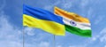 Flags of Ukraine and India on flagpoles in center. Flags on sky background. Place for text. Ukrainian. Indian, Asia. 3d