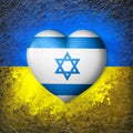 Flags of Ukraine and Israel. Flag heart on the background of the Ukrainian flag painted on a stone. The concept of protection.