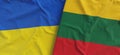 Flags of Ukraine and Lithuania. Linen flags close up. Flag made of canvas. Ukrainian. Lithuanian, Vilnius. National symbols. 3d Royalty Free Stock Photo