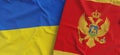 Flags of Ukraine and Montenegro. Linen flag close up. Flag made of canvas. Ukrainian, Kyiv. Podgorica. National symbols. 3d
