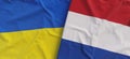 Flags of Ukraine and Netherlands. Linen flags close up. Flag made of canvas. Ukrainian. Holland, Amsterdam. National symbols. 3d Royalty Free Stock Photo