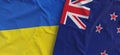 Flags of Ukraine and New Zealand. Linen flags close up. Flag made of canvas. Ukrainian. Wellington, Oceania. National symbols. 3d Royalty Free Stock Photo