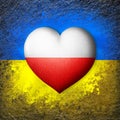 Flags of Ukraine and Poland. Flag heart on the background of the Ukrainian flag painted on a stone. The concept of protection.