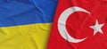 Flags of Ukraine and Turkey. Linen flags close up. Flag made of canvas. Ukrainian. Turkish, Ankara. National symbols. 3d