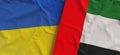 Flags of Ukraine and UAE. Linen flags close up. Flag made of canvas. Ukrainian. United Arab Emirates. National symbols. 3d Royalty Free Stock Photo