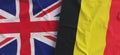 Flags of United Kingdom and Belgium. Linen flags close-up. Flag made of canvas. Great Britain. English. Belgian. National symbols