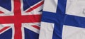 Flags of United Kingdom and Finland. Linen flags close-up. Flag made of canvas. Great Britain. English. Finnish. National symbols