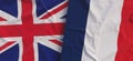 Flags of United Kingdom and France. Linen flags close-up. Flag made of canvas. Great Britain. English. French. National symbols.