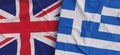 Flags of United Kingdom and Greece. Linen flags close-up. Flag made of canvas. Greek. Great Britain. UK flag. State national