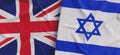 Flags of United Kingdom and Israel. Linen flags close-up. Flag made of canvas. Great Britain. London. Israeli, Jerusalem. National Royalty Free Stock Photo