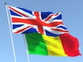 The flags of United Kingdom and Mali on the blue sky. For news, reportage, business. 3d illustration