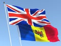 The flags of United Kingdom and Moldova on the blue sky. For news, reportage, business. 3d illustration