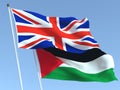 The flags of United Kingdom and Palestine on the blue sky. For news, reportage, business. 3d illustration