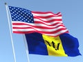 The flags of United States and Barbados on the blue sky. For news, reportage, business. 3d illustration
