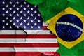 Flags of United States and Brazil on cracked wall Royalty Free Stock Photo