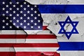Flags of United States and Israel on cracked wall