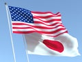 The flags of United States and Japan on the blue sky. For news, reportage, business. 3d illustration Royalty Free Stock Photo