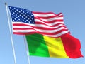 The flags of United States and Mali on the blue sky. For news, reportage, business. 3d illustration