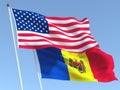 The flags of United States and Moldova on the blue sky. For news, reportage, business. 3d illustration