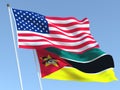 The flags of United States and Mozambique on the blue sky. For news, reportage, business. 3d illustration
