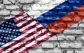 The flags of the United States and Russia painted on a ruined wall and divided by a diagonal crack Royalty Free Stock Photo