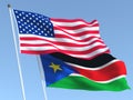 The flags of United States and South Sudan on the blue sky. For news, reportage, business. 3d illustration