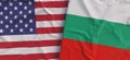 Flags of USA and Bulgaria. Linen flag close-up. Flag made of canvas. United States of America. Bulgarian. State national symbols.