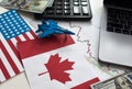 flags of the USA and Canada, dollars, charts Royalty Free Stock Photo