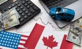 flags of the USA and Canada, dollars, charts Royalty Free Stock Photo