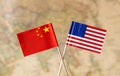 Flags of the USA and China over the world map, political leader countries concept image Royalty Free Stock Photo