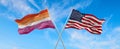 flags USA and Lesbian Pride waving in the wind on flagpole against the sky with clouds on sunny day. 3d illustration Royalty Free Stock Photo