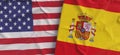 Flags of USA and Spain. Linen flags close-up. Flag made of canvas. United States of America. Spanish. State national symbols. 3d