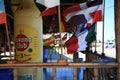 Terrace of a roadside restaurant with different flags. Cuba island