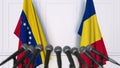 Flags of Venezuela and Romania at international meeting or negotiations press conference. 3D rendering Royalty Free Stock Photo