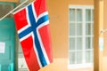 Flags on wall of building in Trondheim, Norway.