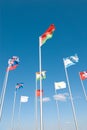 Flags waving across blue sky Royalty Free Stock Photo