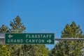 Flagstaff and Grand Canyon Road Sign in the Arizona Pine Forest. Flagstaff, Arizona Royalty Free Stock Photo