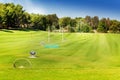 Flagsticks, markers and bunkers at the golf course Royalty Free Stock Photo