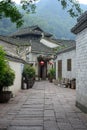 A flagstone alley leads through Asian-style buildings that make up Fengshuan Ancient City in Tibet, China