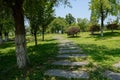 Flagstone path in grassy lawn on slope
