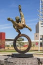 The Flair Olympic Statue in Georgia International Plaza with lush green trees and grass and a gorgeous clear blue sky Royalty Free Stock Photo