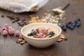 Flakes with berries in brown bowl Royalty Free Stock Photo