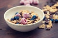 Flakes with berries in brown bowl Royalty Free Stock Photo